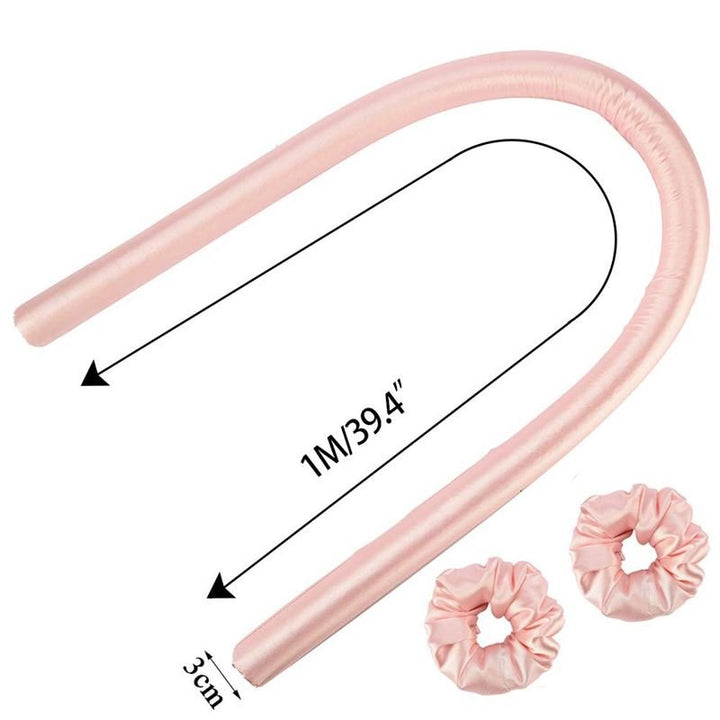 The Fashiongirl Heatless Hair Curlers in pink let you get beautiful curls without heat. Each 1m x 3cm satin rod comes with two matching pink scrunchies, inspired by the popular TikTok hair curler trend.