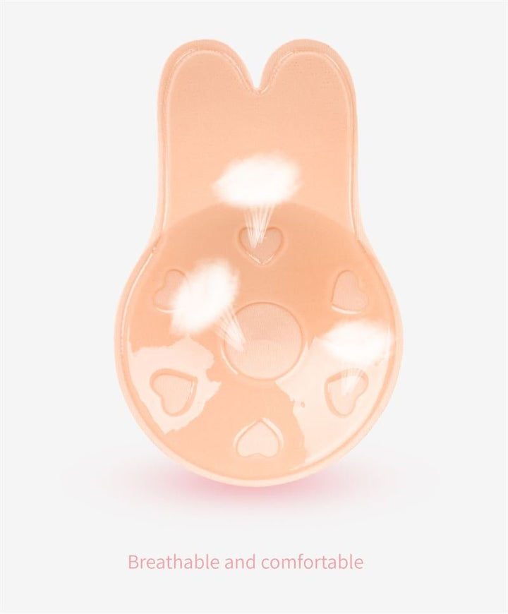 The Shapelux Lifting Pads for Invisible Breast Lift are beige, bunny-shaped silicone pads with heart-shaped air holes for breathability—comfortable and strapless as a strong adhesive bra alternative.