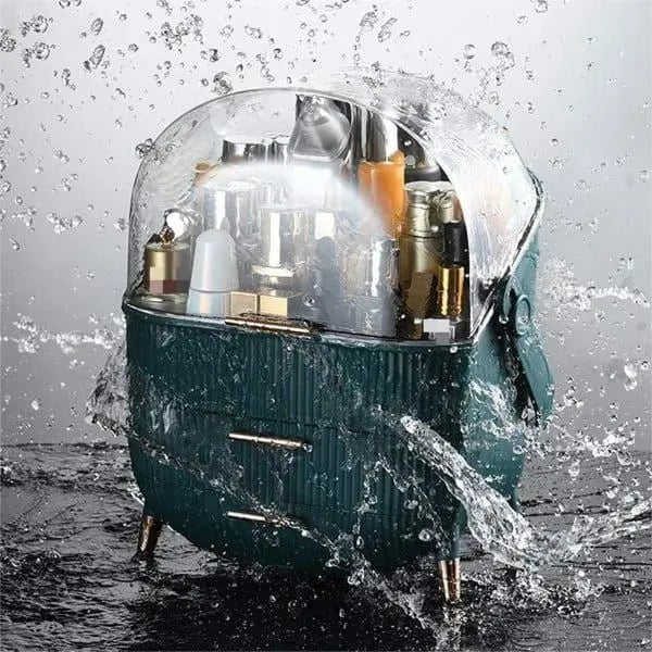 The UNIQ Retro Makeup Box Organiser in Dark Mint/Dark Green by UNIQ features a clear lid and stands on small legs, keeping your cosmetics safe from splashes while neatly storing bottles and other items inside.