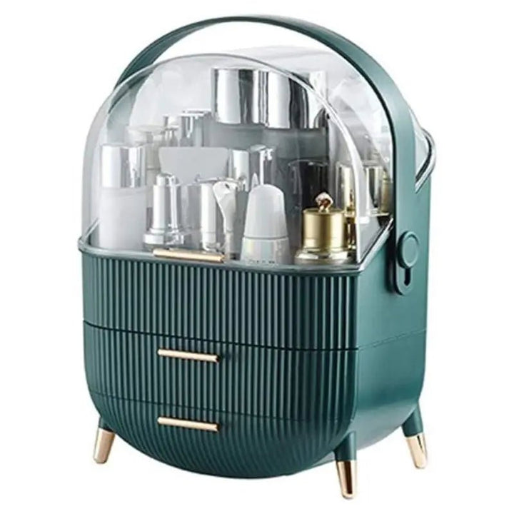The UNIQ Retro Makeup Box Organiser in dark mint/dark green features a clear domed lid, gold-accented legs, two drawers, and organised cosmetic containers—a modern, stylish vanity essential from UNIQ.