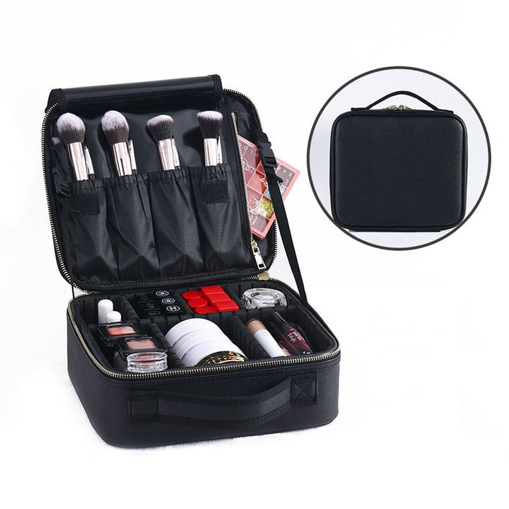 The UNIQ makeup travel bag by UNIQ is a black cosmetic and toiletry case with adjustable compartments, neatly organizing brushes and cosmetics. Shown open to display makeup items, plus a smaller image reveals the sturdy handled closed bag.